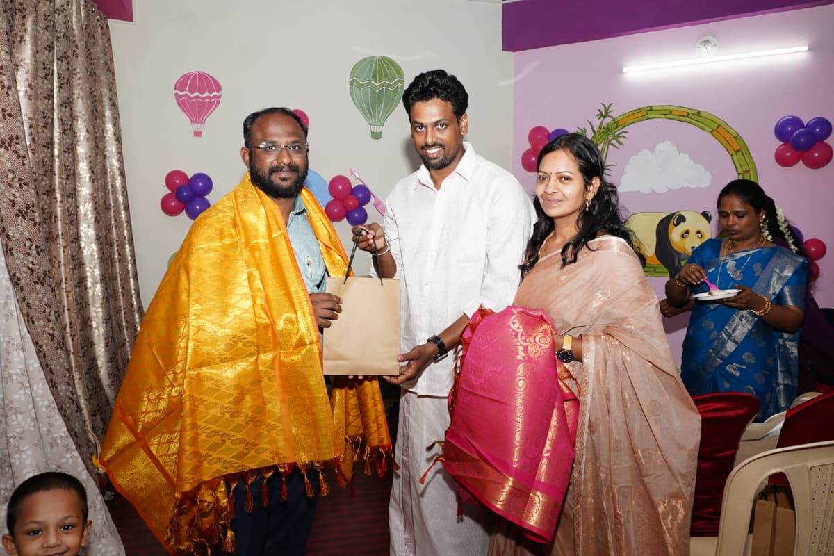 Tiny Cradle founders honoring Dr. S. Premkumar with the ceremonial golden shawl