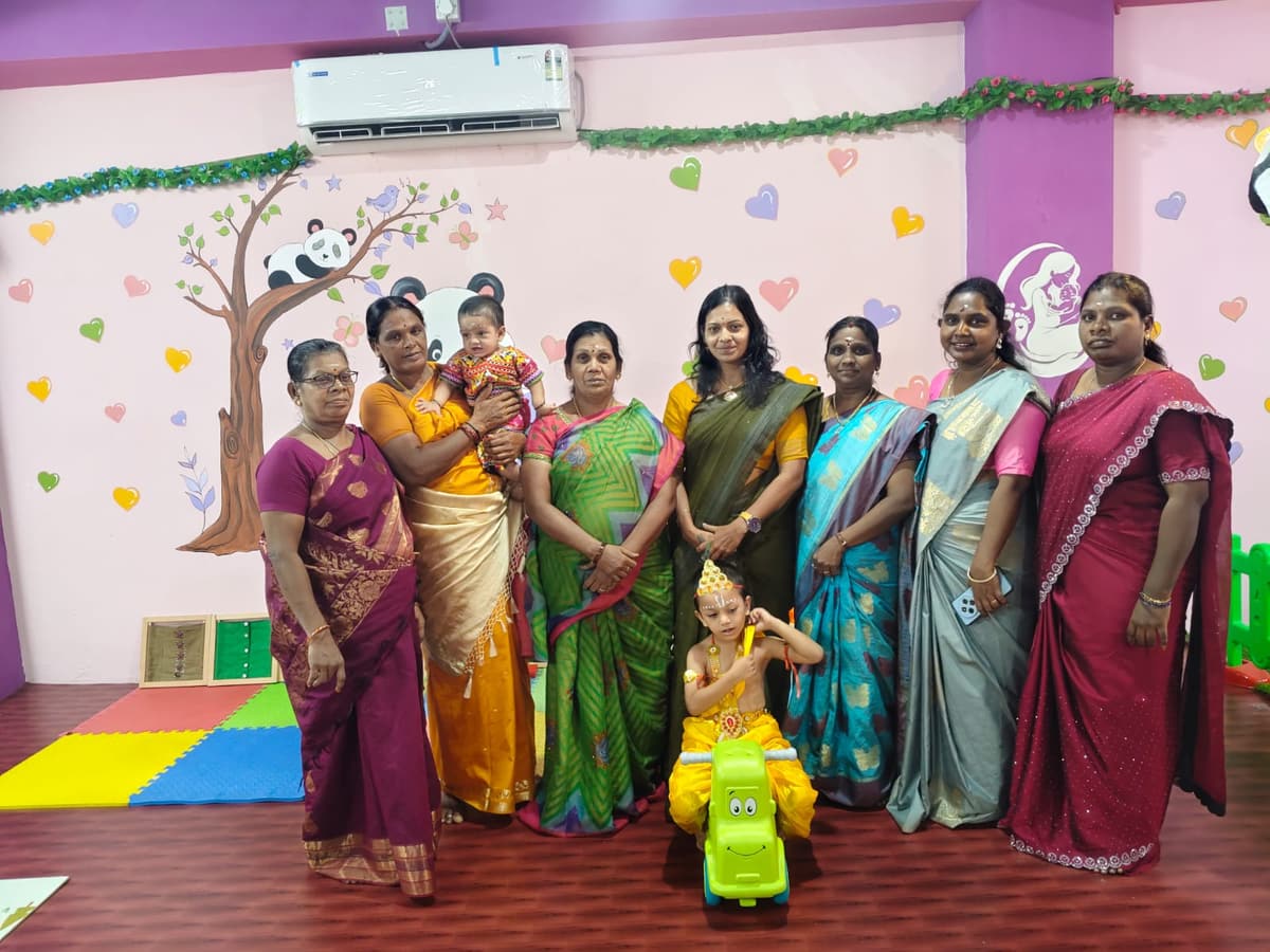 The Tiny Cradle centre team photographed with children in our Lawspet playroom